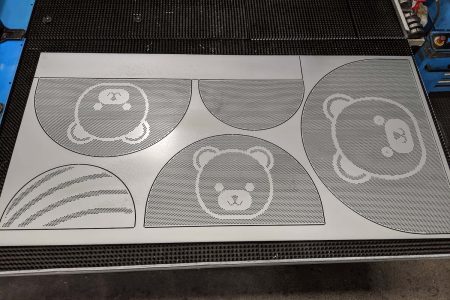 BOBA BEAR Custom metal perforation of bear and rainbow designs using CNC turret punching for decorative sheet metal applications
