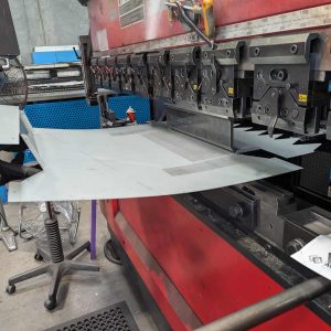 Sheet metal bending using CNC press brake, highlighting precision metal forming, fabrication, and industrial sheet metal work
